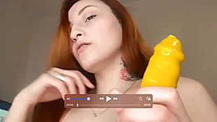 Redhead Asian piece of baggage sucks dildo with the addition of takes a estimated throat